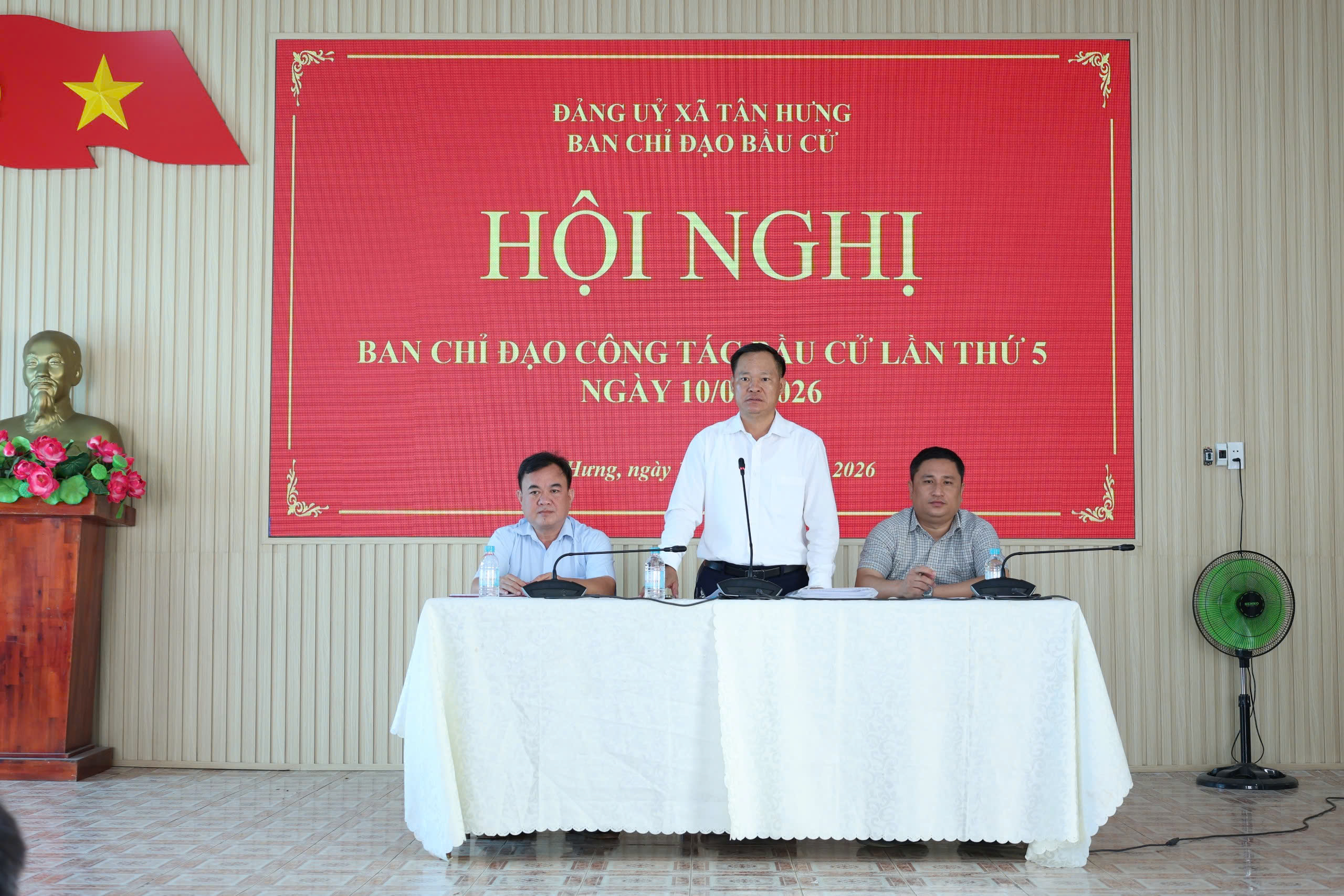 'A group of men sitting at a table

Description automatically generated'