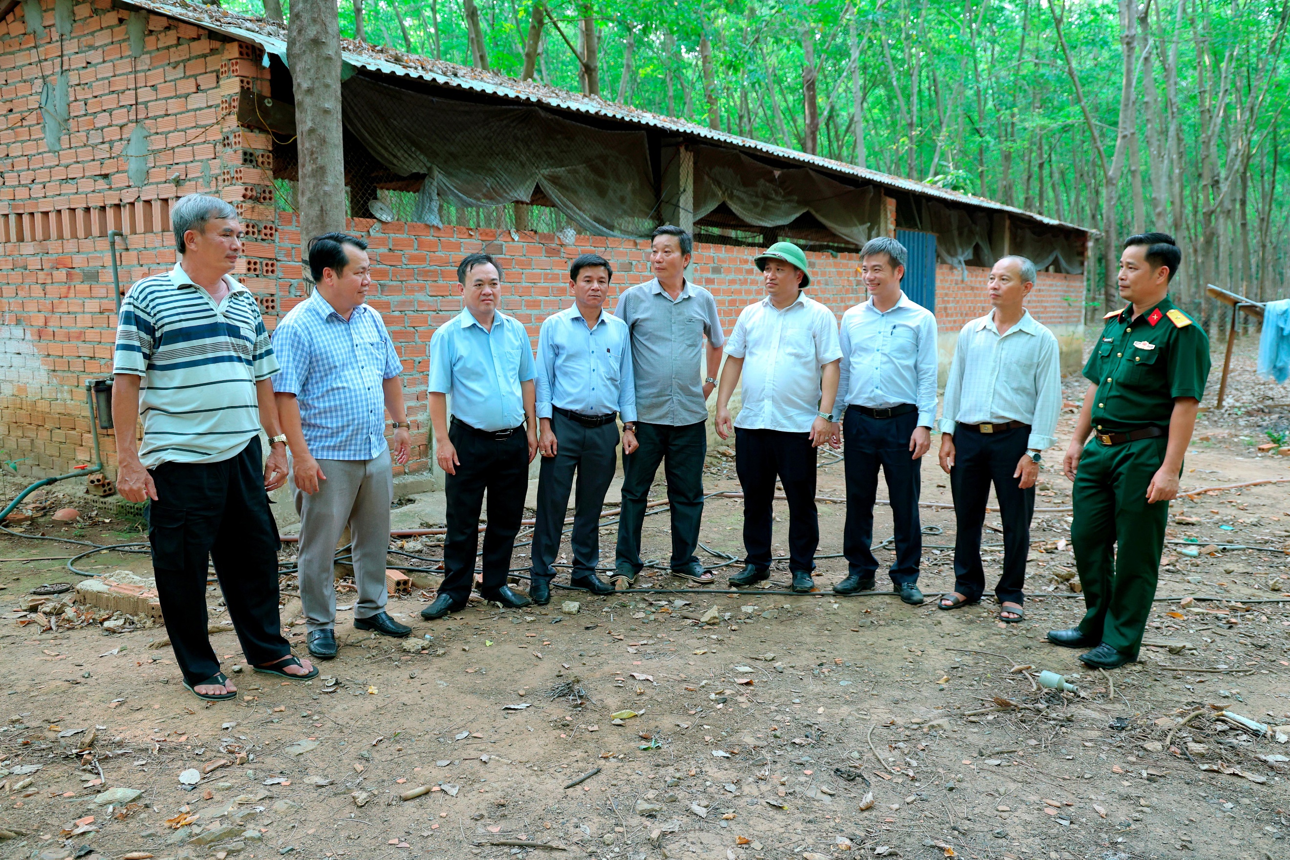 ''A group of men standing in a circle

Description automatically generated''