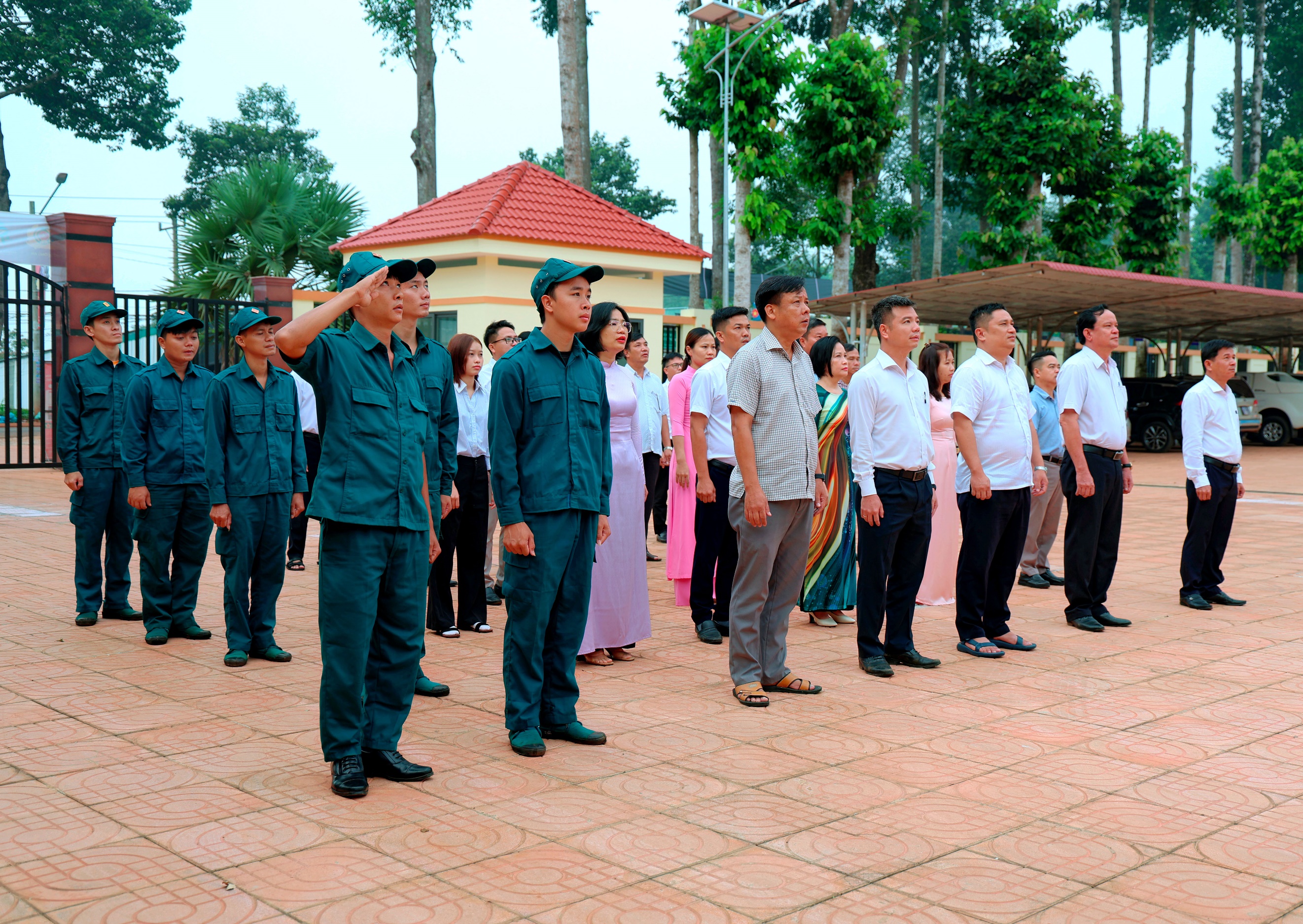 'A group of people standing in a line

Description automatically generated'