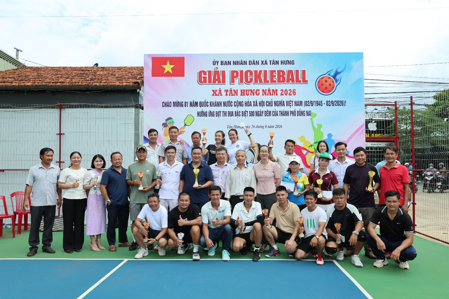 A group of people posing for a photo

Description automatically generated
